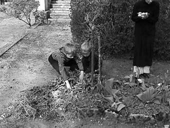 R+r egg hunt while  Gil holds the find