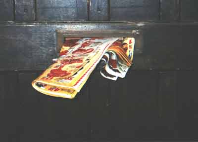 Inge Broska door with commercial flyers sticking out